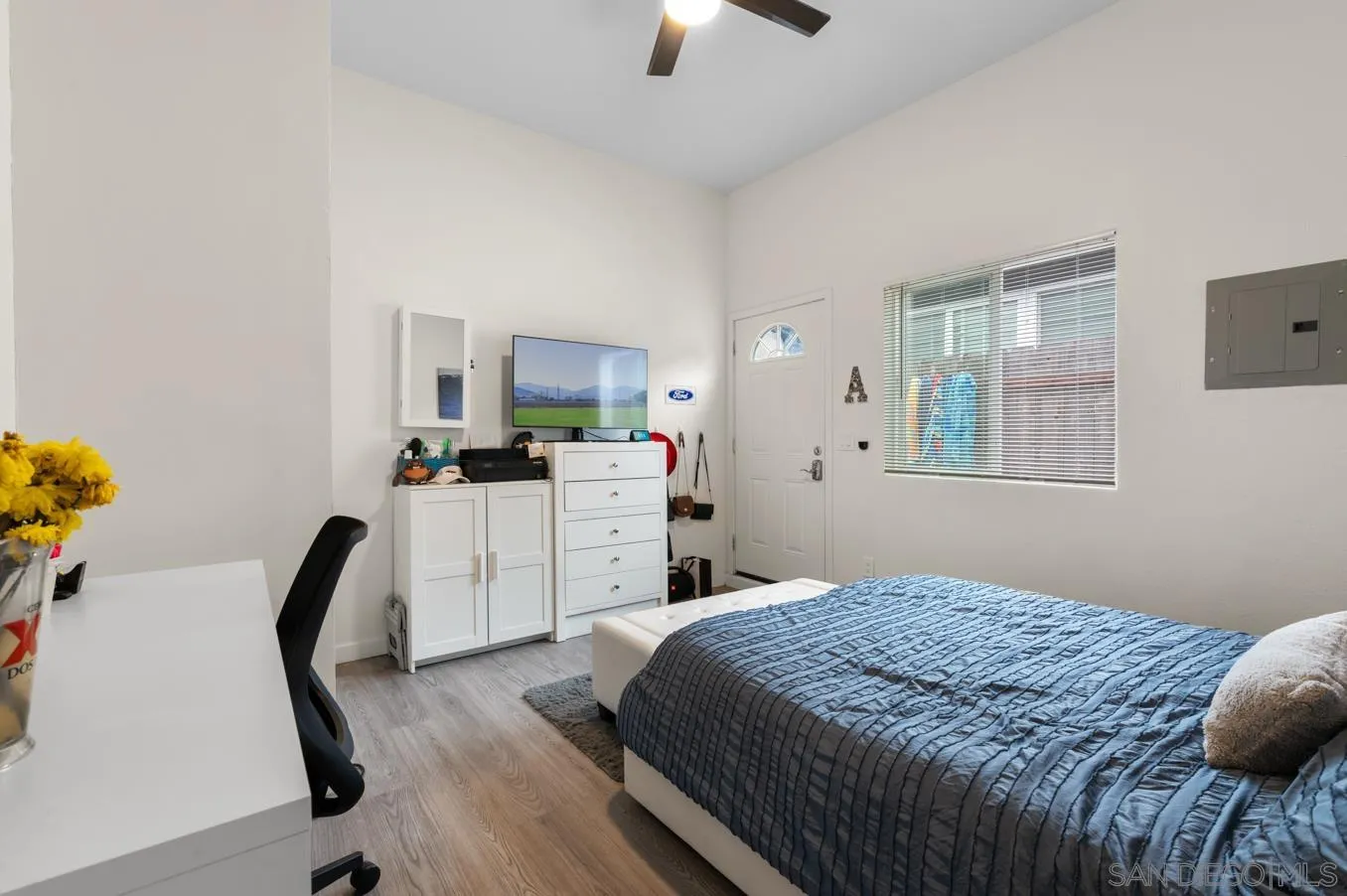 5555 Mary Ln Drive San Diego, CA 92115 - Photo 27 of 39 a bedroom that has a bed and a chair in it