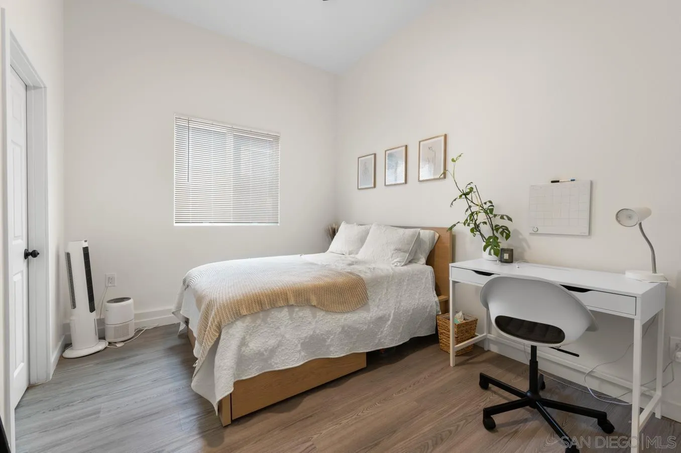 5555 Mary Ln Drive San Diego, CA 92115 - Photo 28 of 39 a bedroom with a bed and a desk