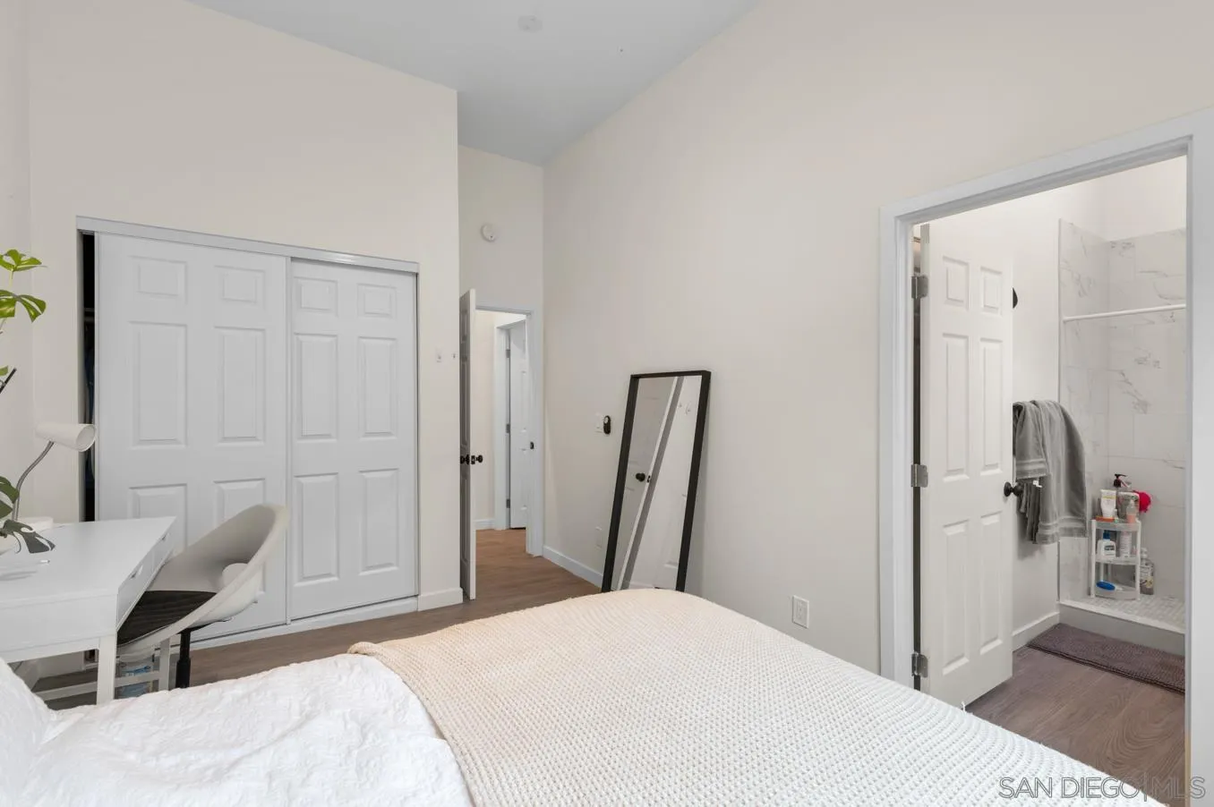 5555 Mary Ln Drive San Diego, CA 92115 - Photo 29 of 39 a bedroom with a bed and a table in it