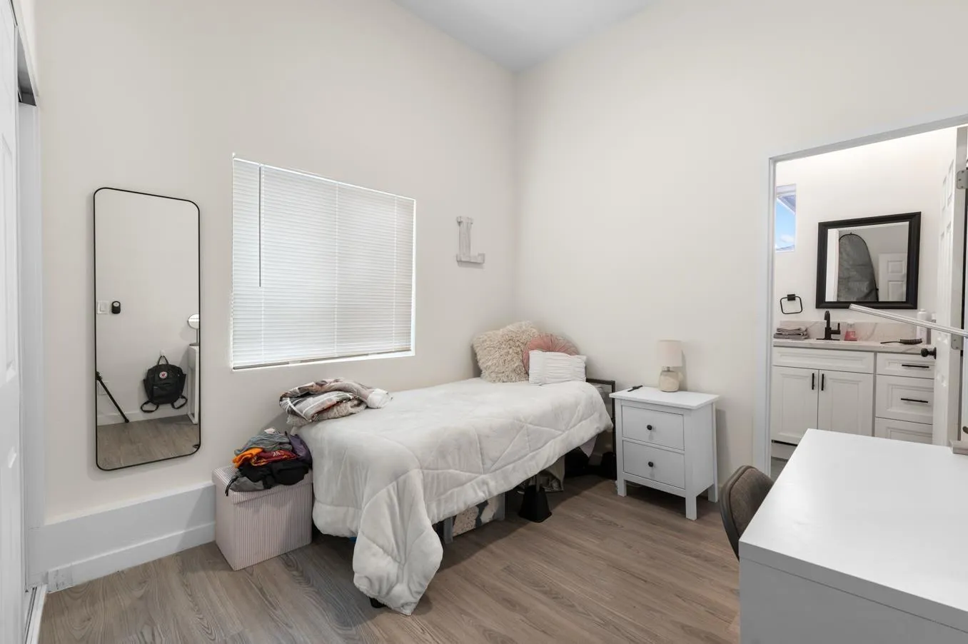 5555 Mary Ln Drive San Diego, CA 92115 - Photo 31 of 39 a bedroom with a bed and a view of bathroom