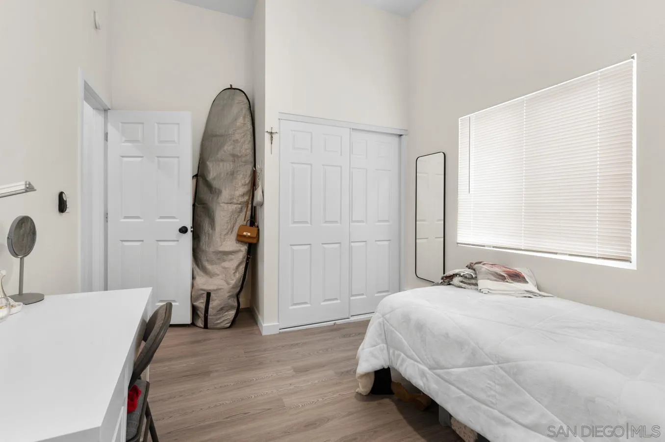 5555 Mary Ln Drive San Diego, CA 92115 - Photo 33 of 39 a bedroom with a bed and a table