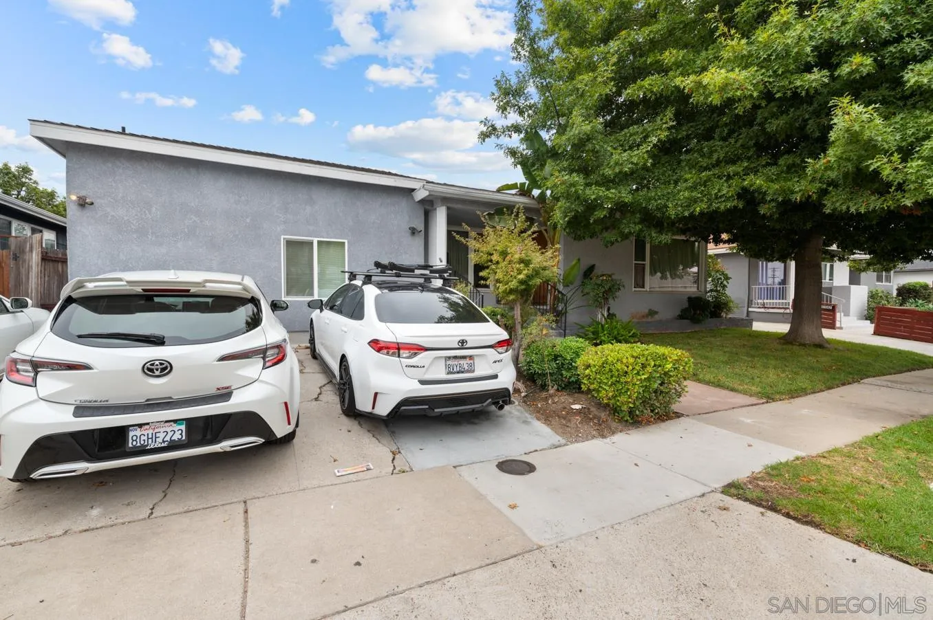 5555 Mary Ln Drive San Diego, CA 92115 - Photo 35 of 39 a car parked in front of white house
