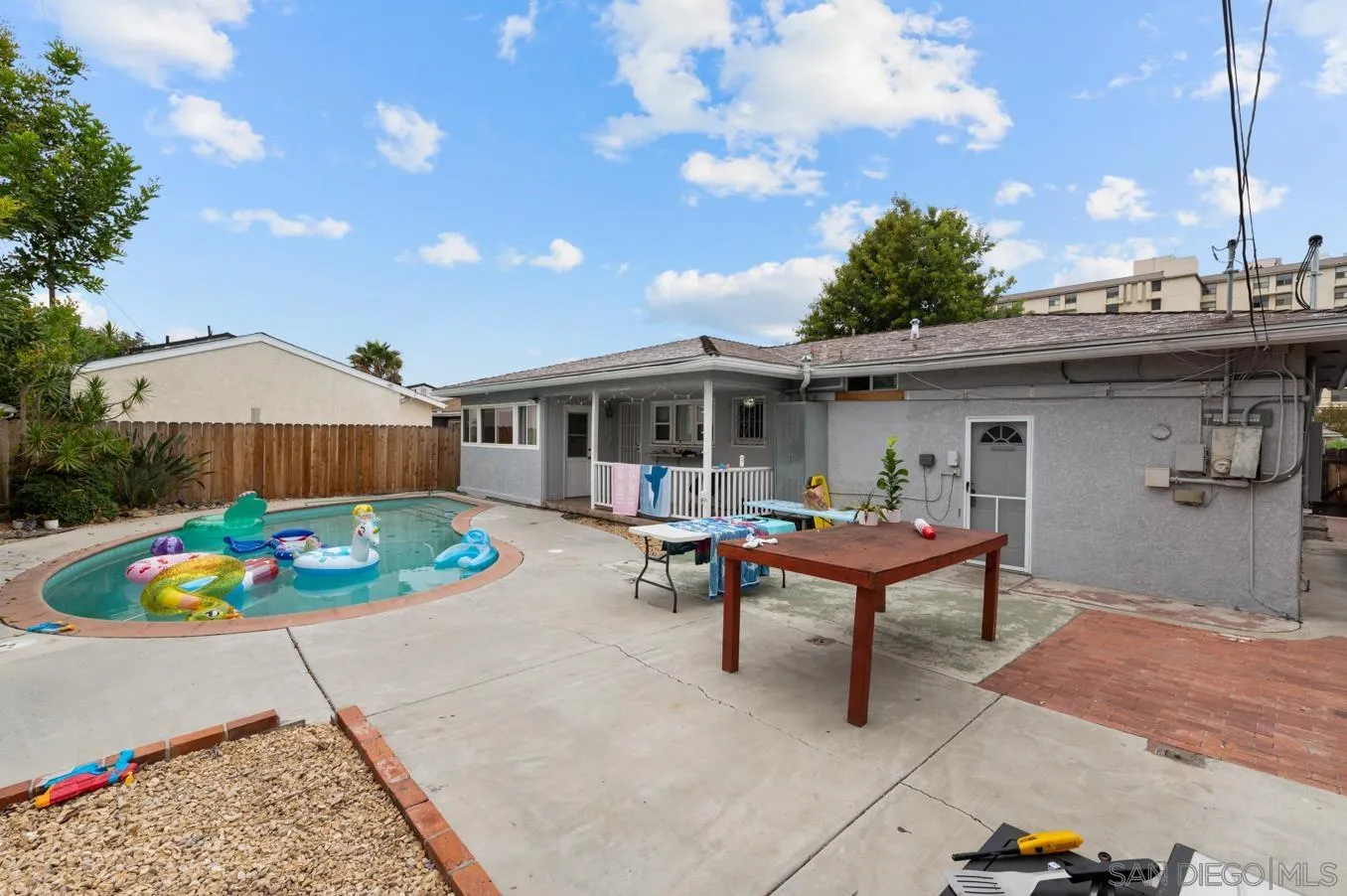 5555 Mary Ln Drive San Diego, CA 92115 - Photo 5 of 39 a view of a house with backyard sitting area and garden