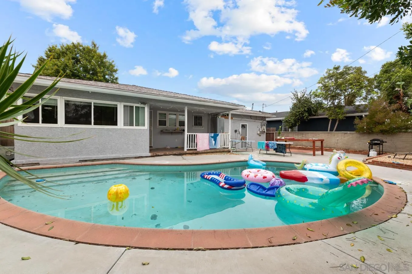 5555 Mary Ln Drive San Diego, CA 92115 - Photo 6 of 39 a view of a house with swimming pool