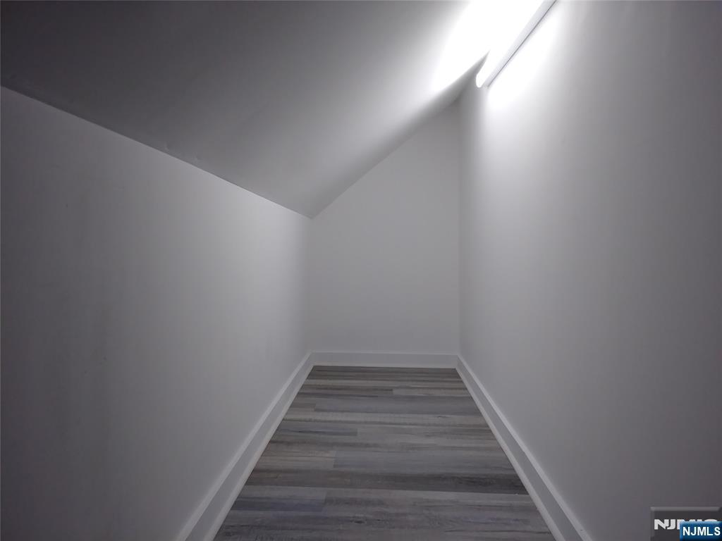 20 Goffle Road Midland Park, NJ 07432 - Photo 14 of 16 a view of a hallway with wooden floor
