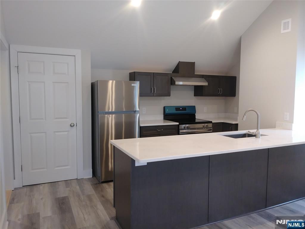 20 Goffle Road Midland Park, NJ 07432 - Photo 2 of 16 a kitchen with stainless steel appliances a sink and refrigerator