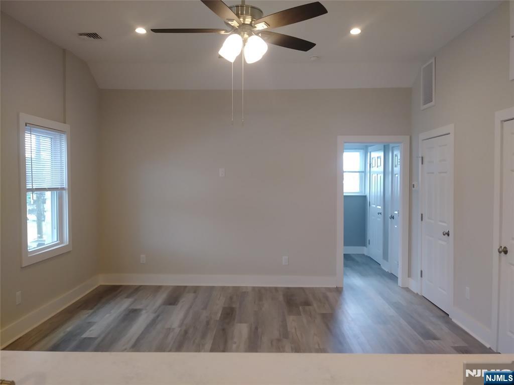20 Goffle Road Midland Park, NJ 07432 - Photo 5 of 16 wooden floor in an empty room with a window