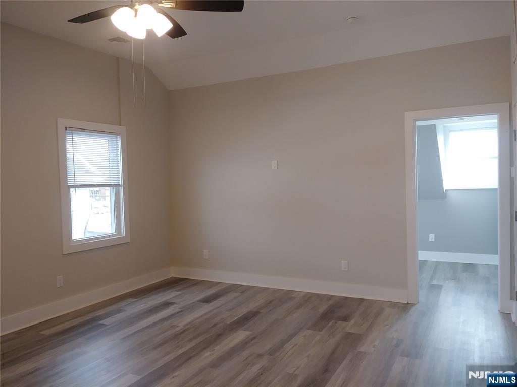 20 Goffle Road Midland Park, NJ 07432 - Photo 6 of 16 an empty room with wooden floor and windows