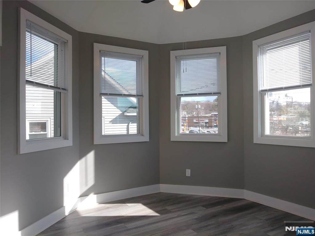 20 Goffle Road Midland Park, NJ 07432 - Photo 8 of 16 a view of an empty room with wooden floor and a window