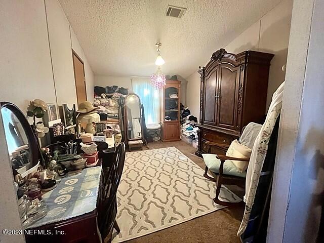380 East End Road San Mateo, FL 32187 - Photo 7 of 9 a view of a hallway with seating area