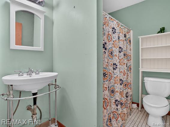 56375 Bates Road New Baltimore, MI 48051 - Photo 22 of 35 Pedestal sink with chrome fixtures, white square tile flooring, white wall-mounted mirror, and white over-toilet shelving