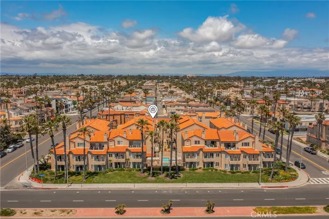 an aerial view of residential houses with a city street