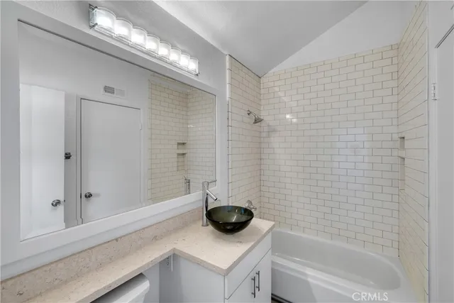 a room with wooden floor and white walls