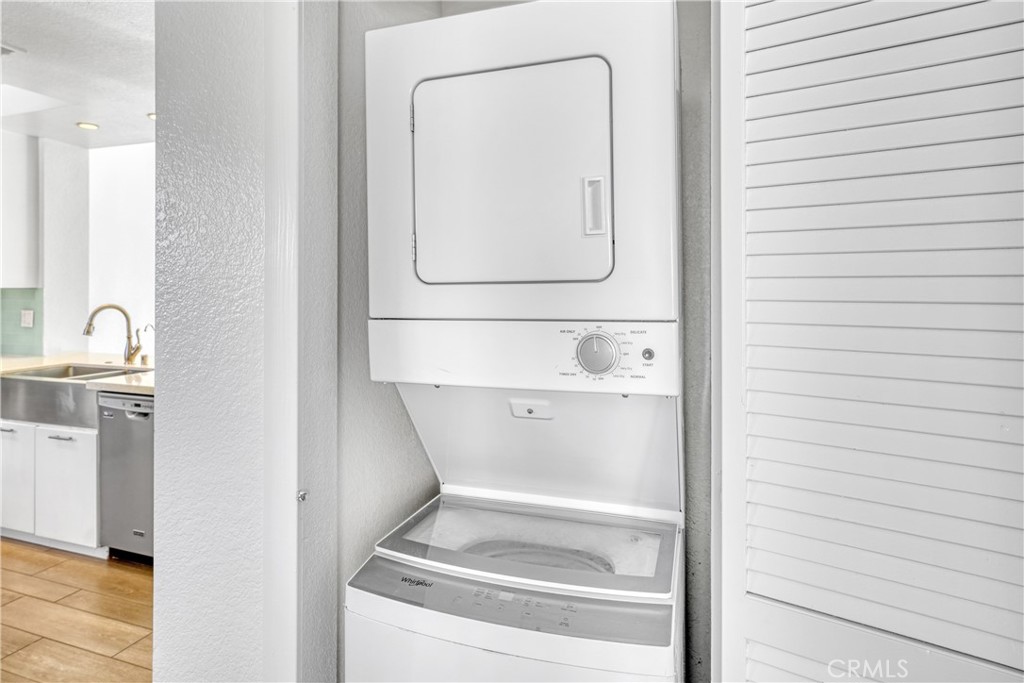 2000 Pacific Coast Highway, Unit 309 Huntington Beach, CA 92648 - Photo 29 of 32 a utility room with a washer and dryer