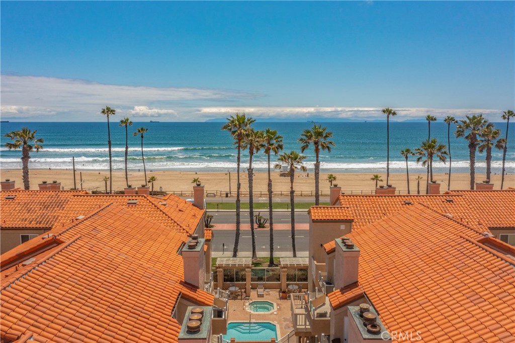 2000 Pacific Coast Highway, Unit 309 Huntington Beach, CA 92648 - Photo 5 of 32 a view of a balcony with floor to ceiling windows with wooden floor