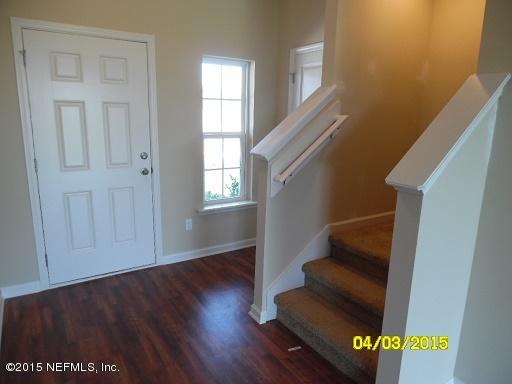3087 Chestnut Ridge Way, Unit 21D Orange Park, FL 32065 - Photo 7 of 34 CR 21D - Foyer, Coat Closet, Staircase