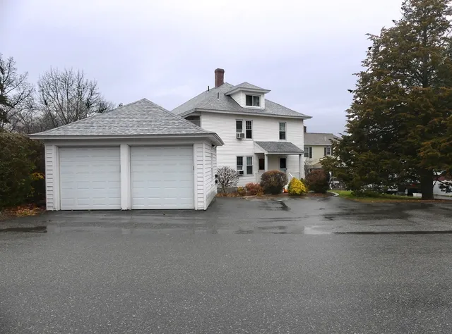 a view of a house with a street