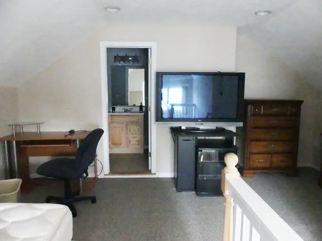 a room with furniture and a piano