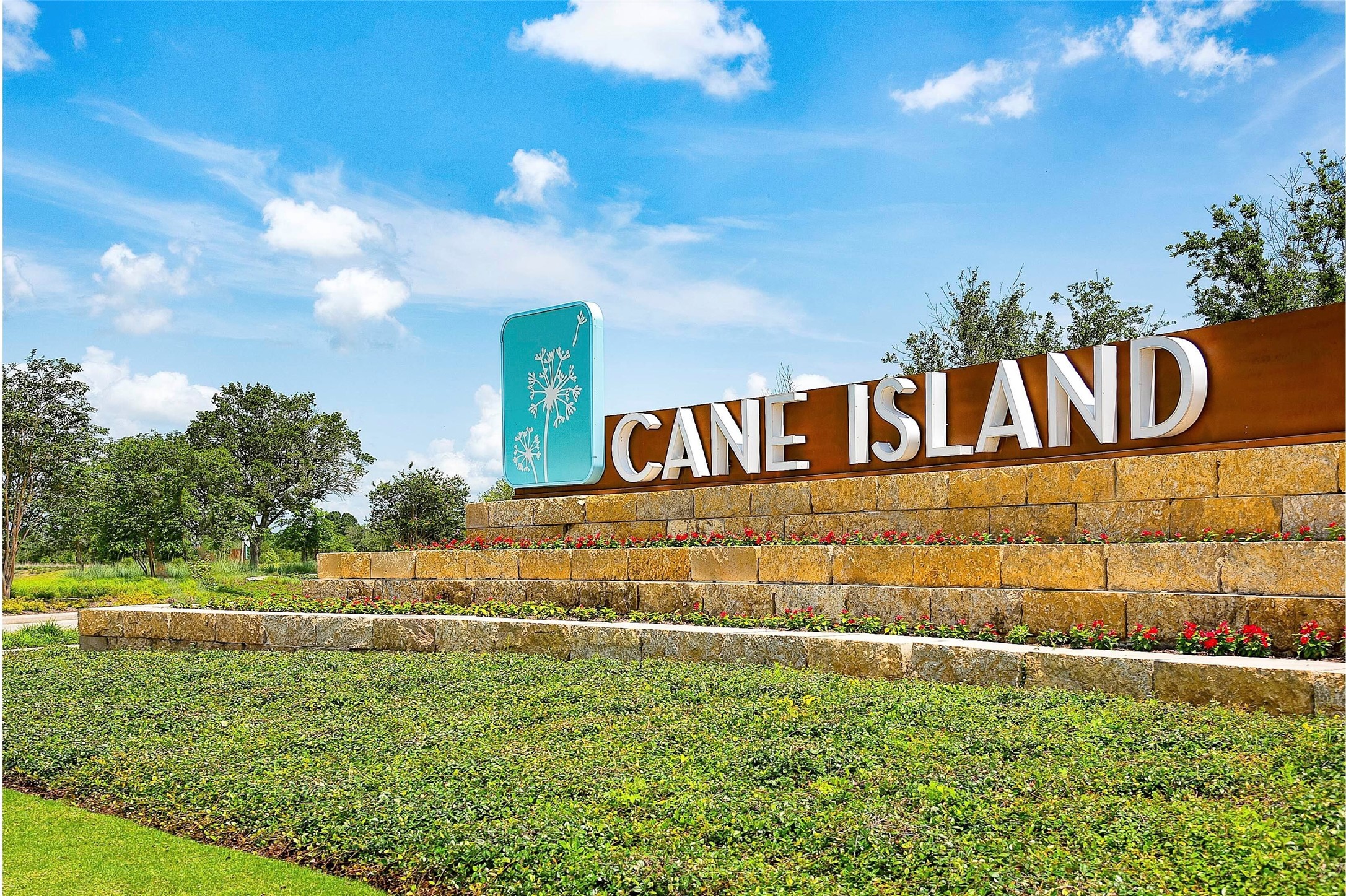 7326 Orangetip Road Katy, TX 77493 - Photo 37 of 43 The Cane Island community entrance features a grand, stone-clad entry gate with elegant architectural details, making a statement as you drive into this prestigious neighborhood.