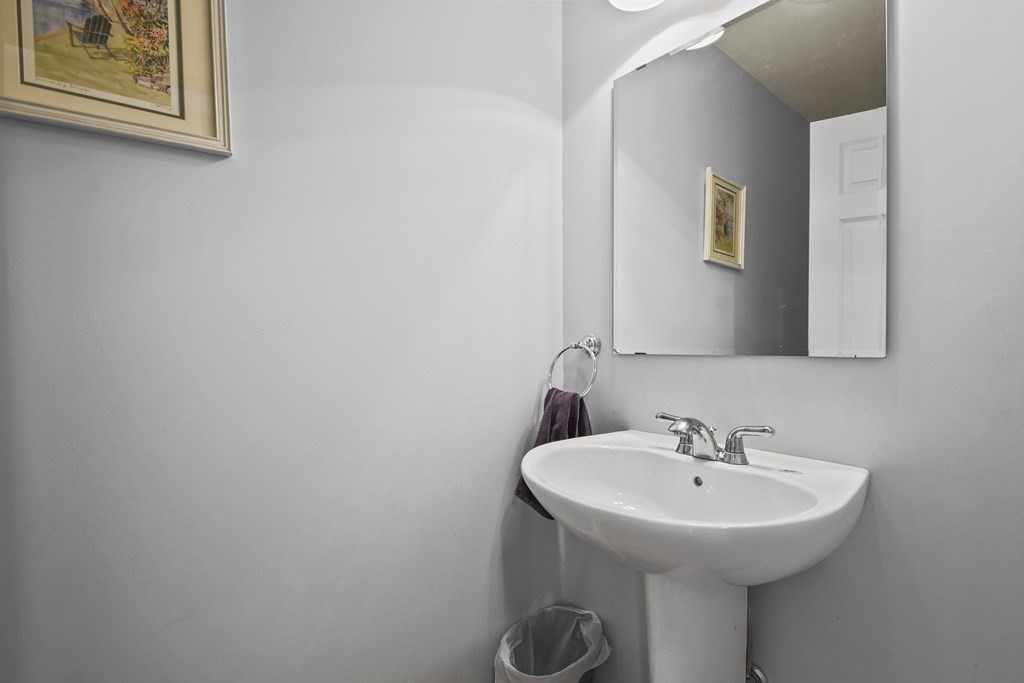 148 Ariel Circle, Unit 148 Sutton, MA 01590 - Photo 11 of 35 a bathroom with a sink and mirror