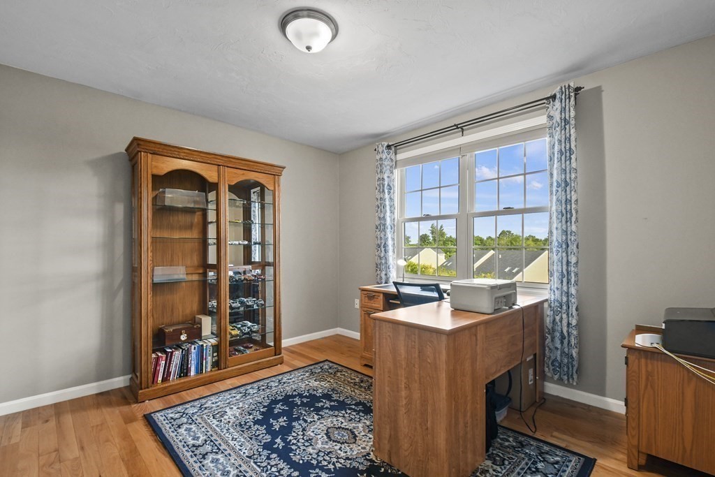 148 Ariel Circle, Unit 148 Sutton, MA 01590 - Photo 12 of 35 a living room with furniture and a window