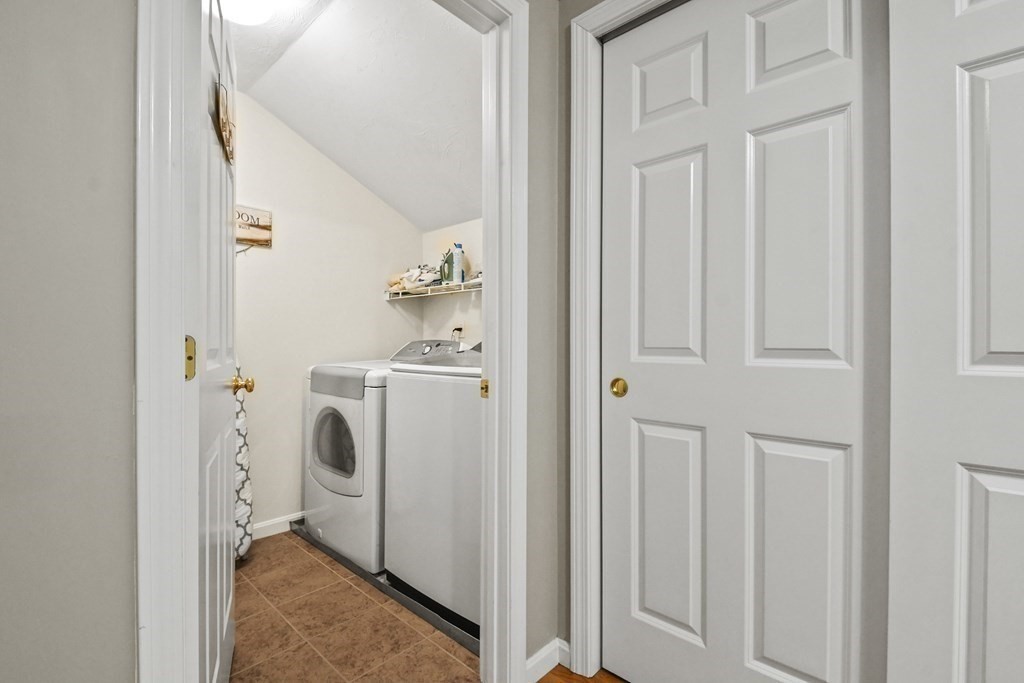 148 Ariel Circle, Unit 148 Sutton, MA 01590 - Photo 21 of 35 a storage room with dryer and washer