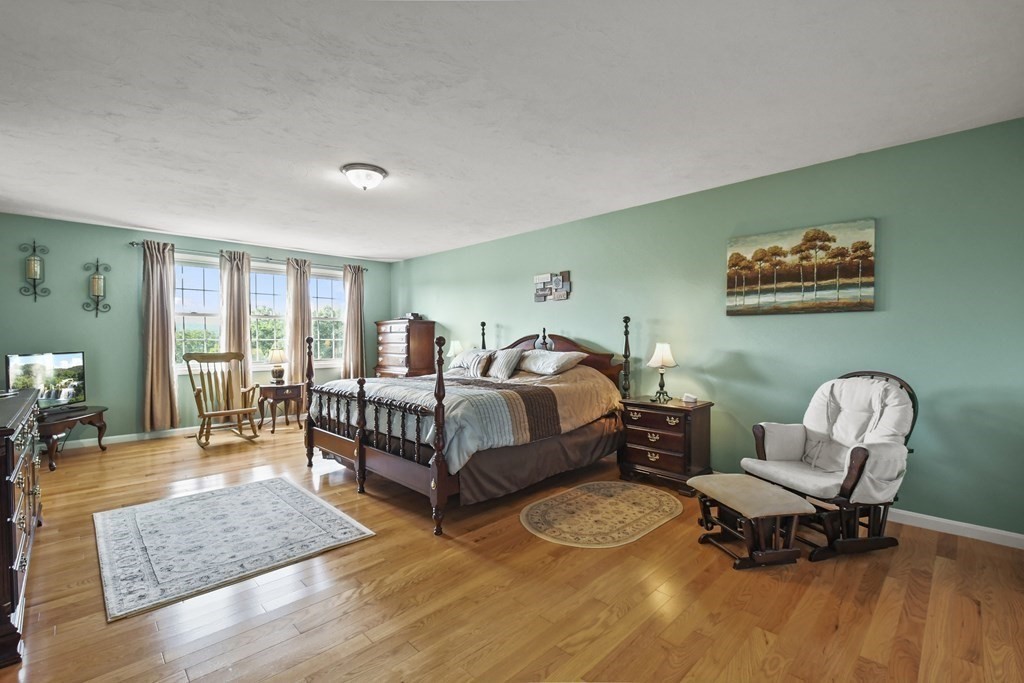 148 Ariel Circle, Unit 148 Sutton, MA 01590 - Photo 22 of 35 a bedroom with furniture and a window