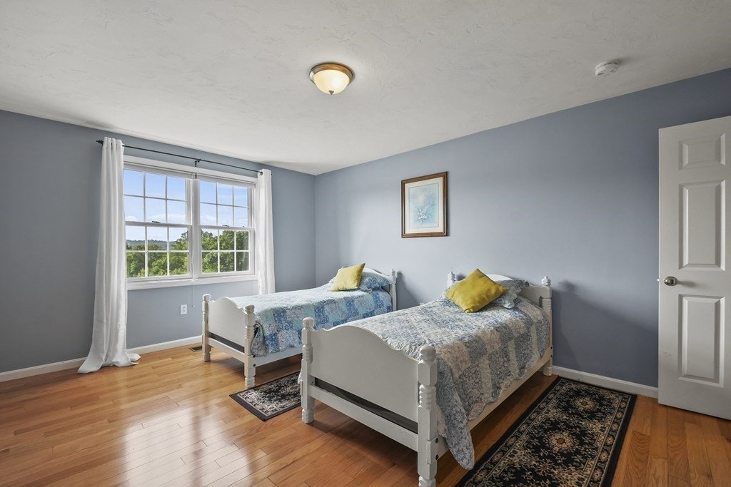 148 Ariel Circle, Unit 148 Sutton, MA 01590 - Photo 27 of 35 a bedroom with bed and a window