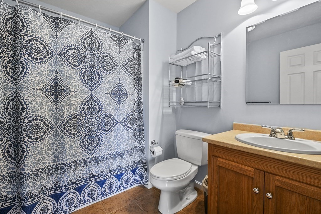 148 Ariel Circle, Unit 148 Sutton, MA 01590 - Photo 29 of 35 a bathroom with a toilet sink and shower