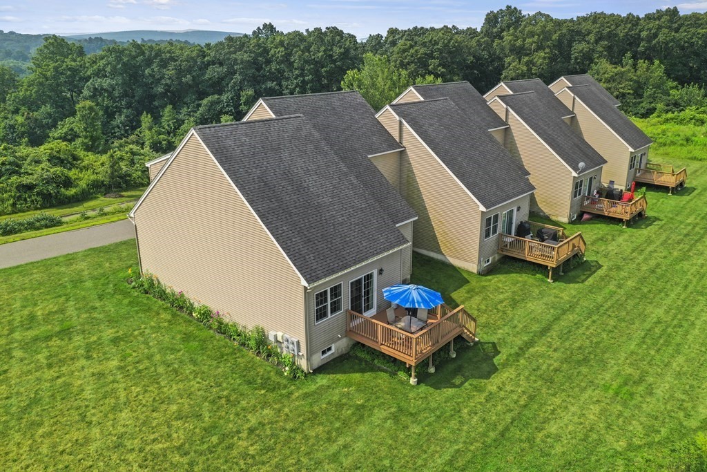 148 Ariel Circle, Unit 148 Sutton, MA 01590 - Photo 33 of 35 a aerial view of a house with pool table and chairs