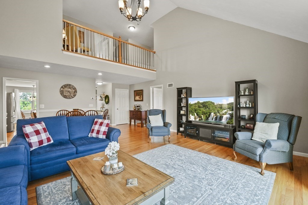 148 Ariel Circle, Unit 148 Sutton, MA 01590 - Photo 5 of 35 a living room with furniture and a flat screen tv