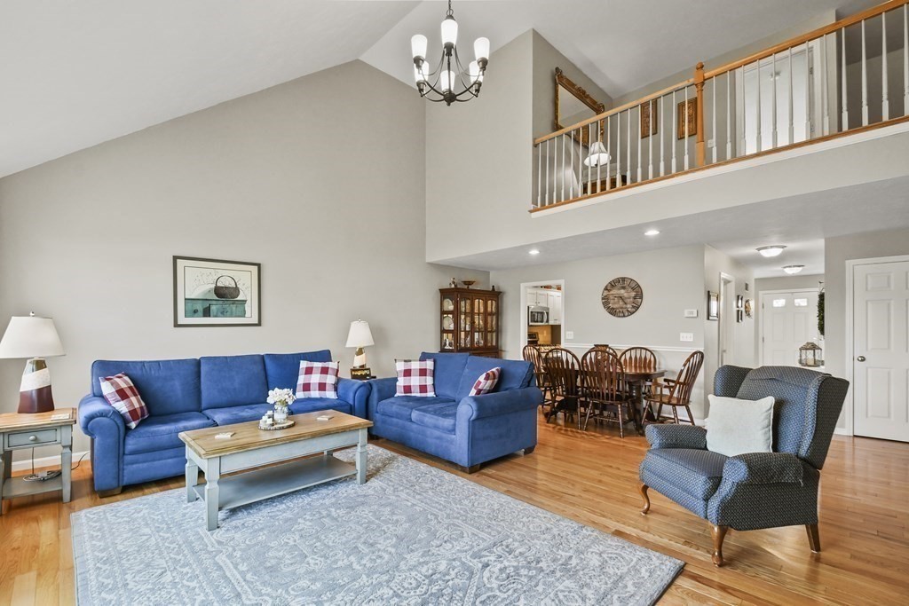 148 Ariel Circle, Unit 148 Sutton, MA 01590 - Photo 6 of 35 a living room with furniture a rug and a window