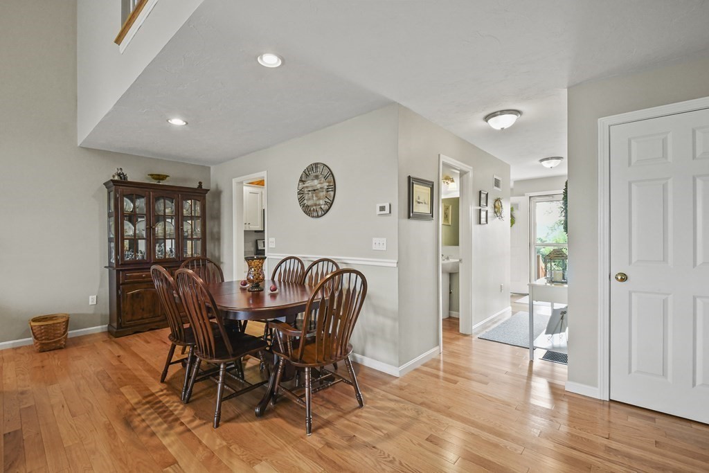 148 Ariel Circle, Unit 148 Sutton, MA 01590 - Photo 9 of 35 a view of a dining room with furniture and wooden floor