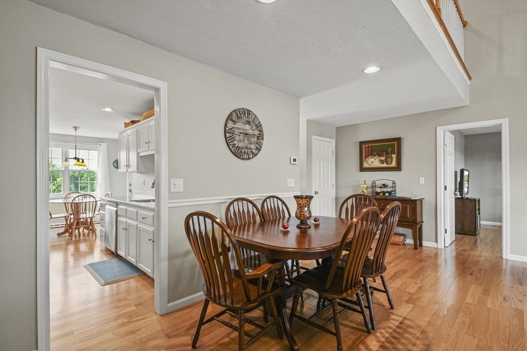 148 Ariel Circle, Unit 148 Sutton, MA 01590 - Photo 10 of 35 a dining room with furniture and wooden floor