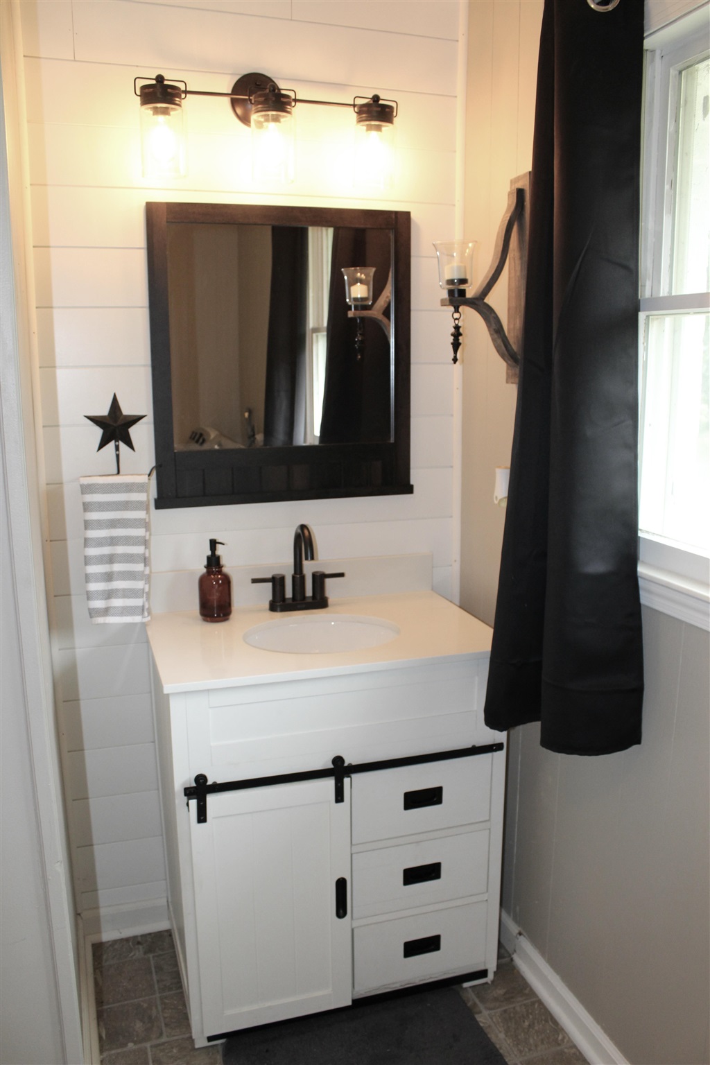 31 Old Back Road Raphine, VA 24472 - Photo 36 of 52 a bathroom with a sink vanity and a mirror