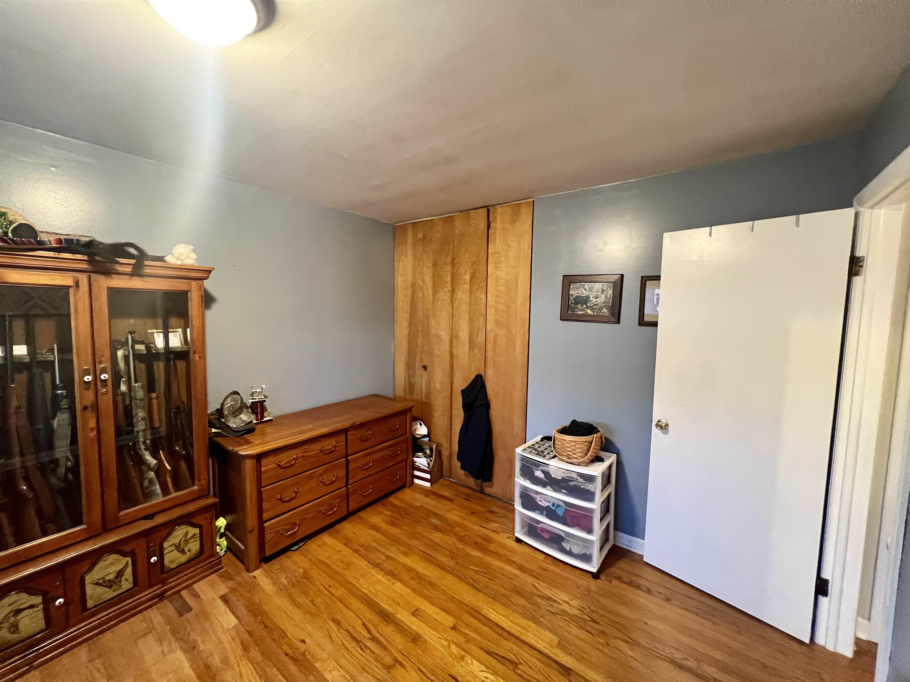 6631 Spring Creek Road Bridgewater, VA 22812 - Photo 17 of 34 a bedroom with furniture and wooden floor