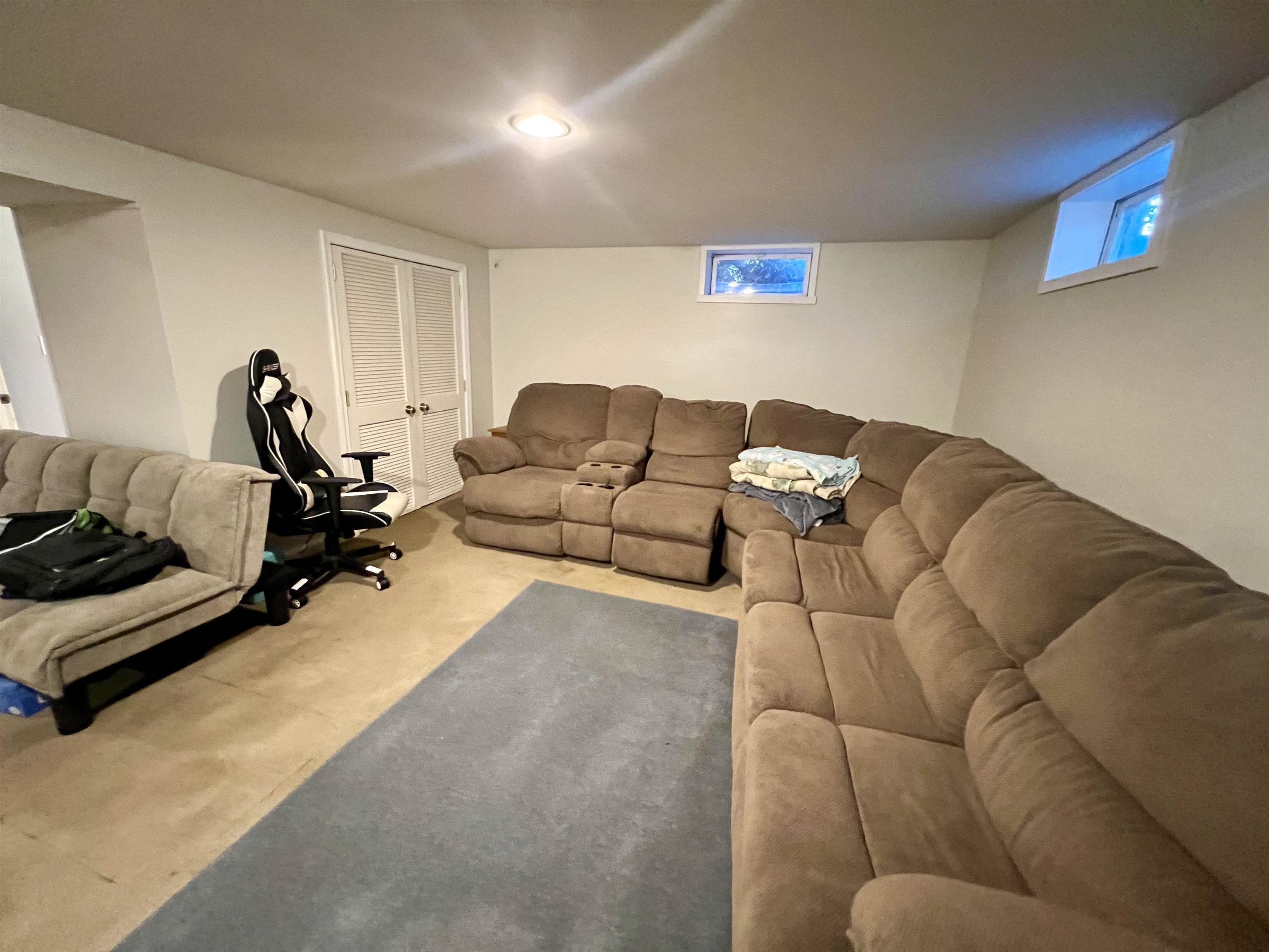 6631 Spring Creek Road Bridgewater, VA 22812 - Photo 30 of 34 a living room with furniture gym equipment and a lamp