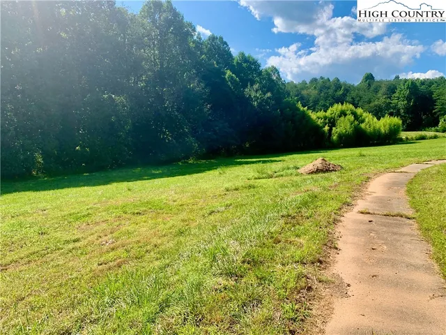 a view of a bench in front of house