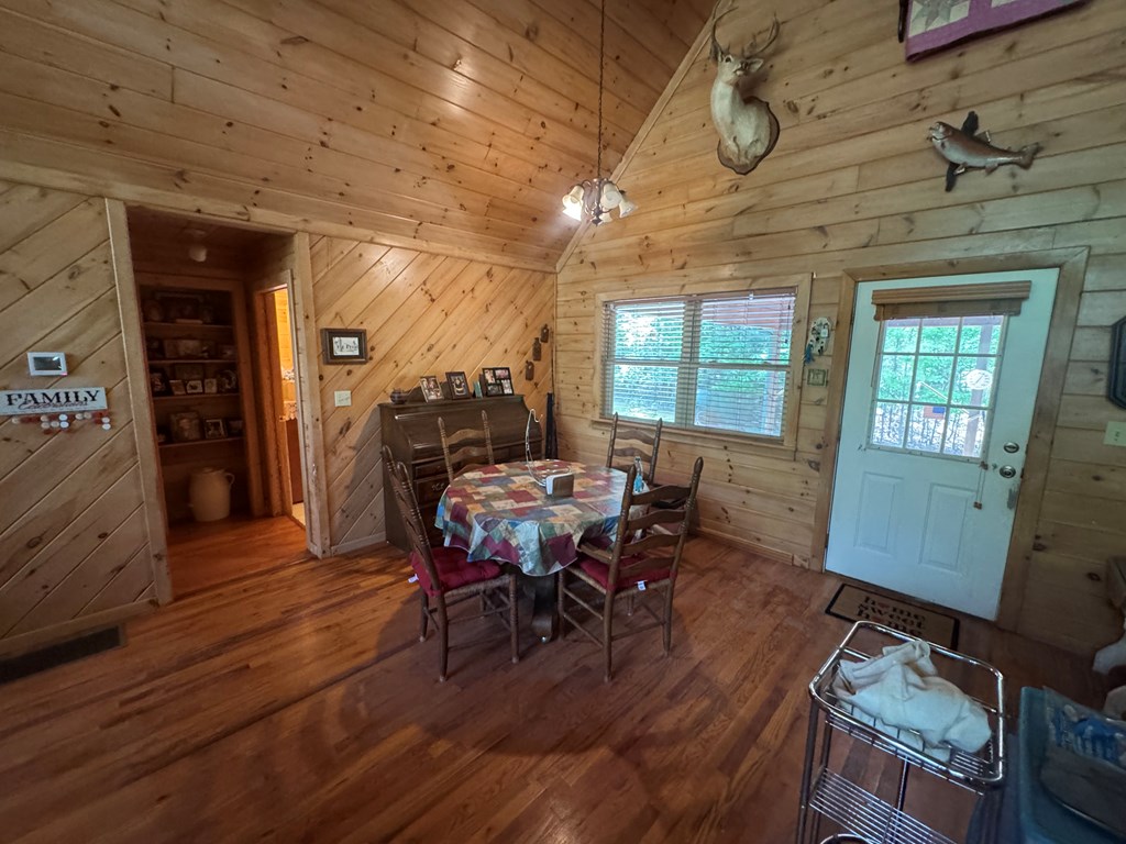 33 Big Tree Road Suches, GA 30572 - Photo 13 of 25 a view of a dining room with furniture window and wooden floor