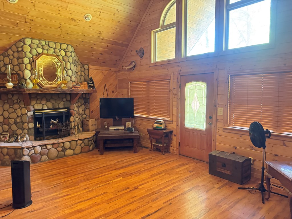 33 Big Tree Road Suches, GA 30572 - Photo 2 of 25 a living room with furniture and a fireplace