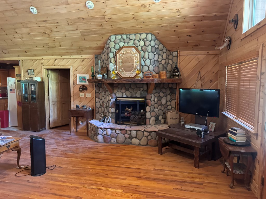 33 Big Tree Road Suches, GA 30572 - Photo 9 of 25 a living room with furniture and a fireplace