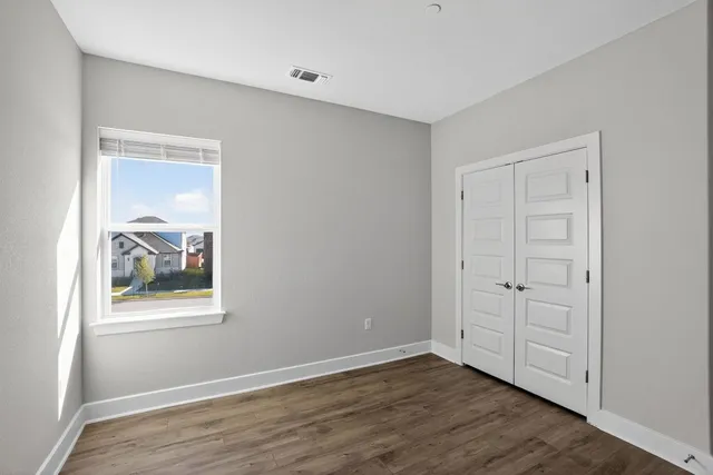 a view of kitchen with furniture and wooden floor