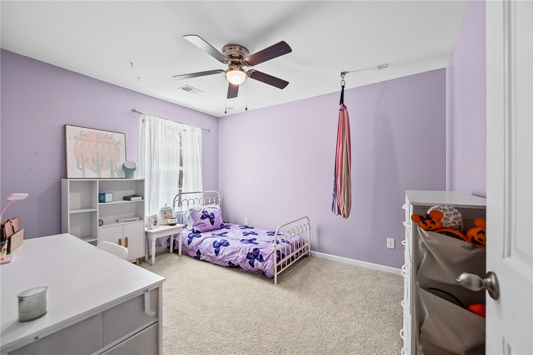 719 Camberwell Road Simpsonville, SC 29680 - Photo 20 of 47 Plush carpeting and a classic multi-pane window establish a comfortable and welcoming atmosphere.