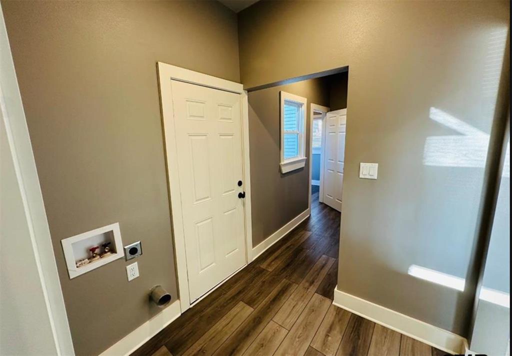1408 East Houston Street Tyler, TX 75702 - Photo 12 of 15 a bathroom with a bathtub and a shower