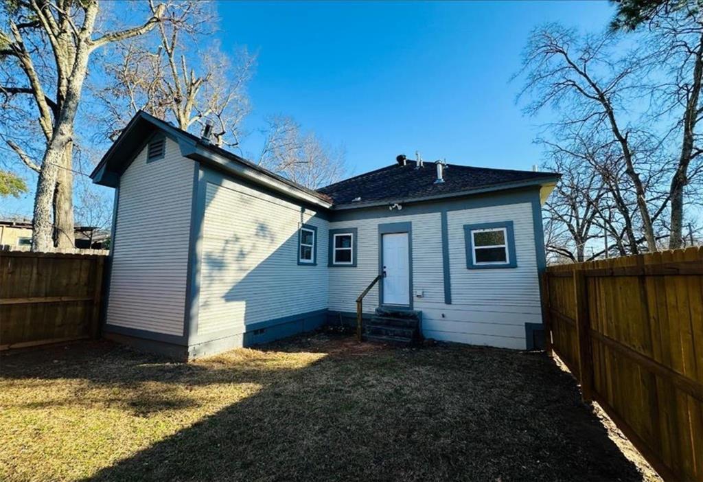 1408 East Houston Street Tyler, TX 75702 - Photo 14 of 15 a view of a house with a yard