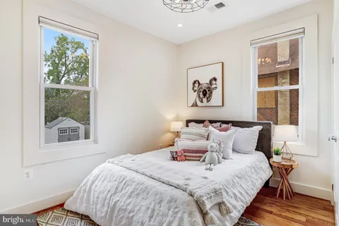 a bedroom with bed and a window