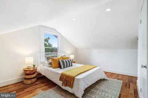 a bedroom with bed and window