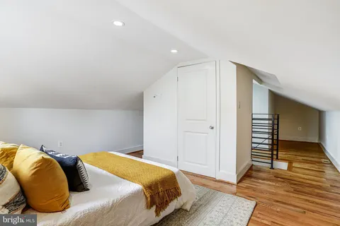 a bedroom with a bed and a walk in closet