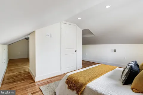 a bedroom with a bed and a walk in closet
