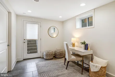 a workspace with furniture and window